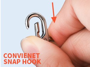 Close-up of a hand holding a silver swivel snap hook, with an orange arrow pointing to the hook mechanism.