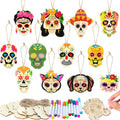 Unfinished wooden sugar skull ornaments in various designs, including skulls, a cat, and a dog, with coloring pens and rope.