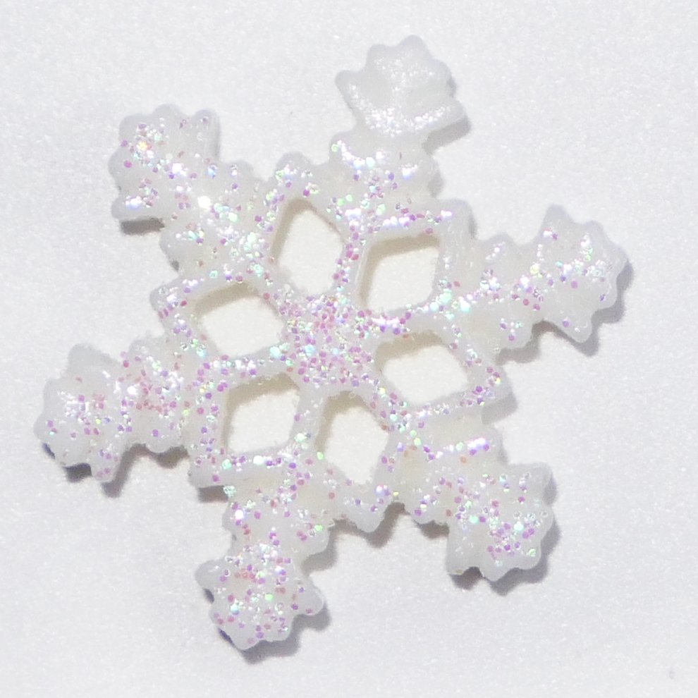 White glitter resin snowflake decoration with pink and purple sparkles, shown from a top-down angle on a white background.