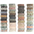 Stacks of washi tape rolls with floral and leaf patterns on a white background.