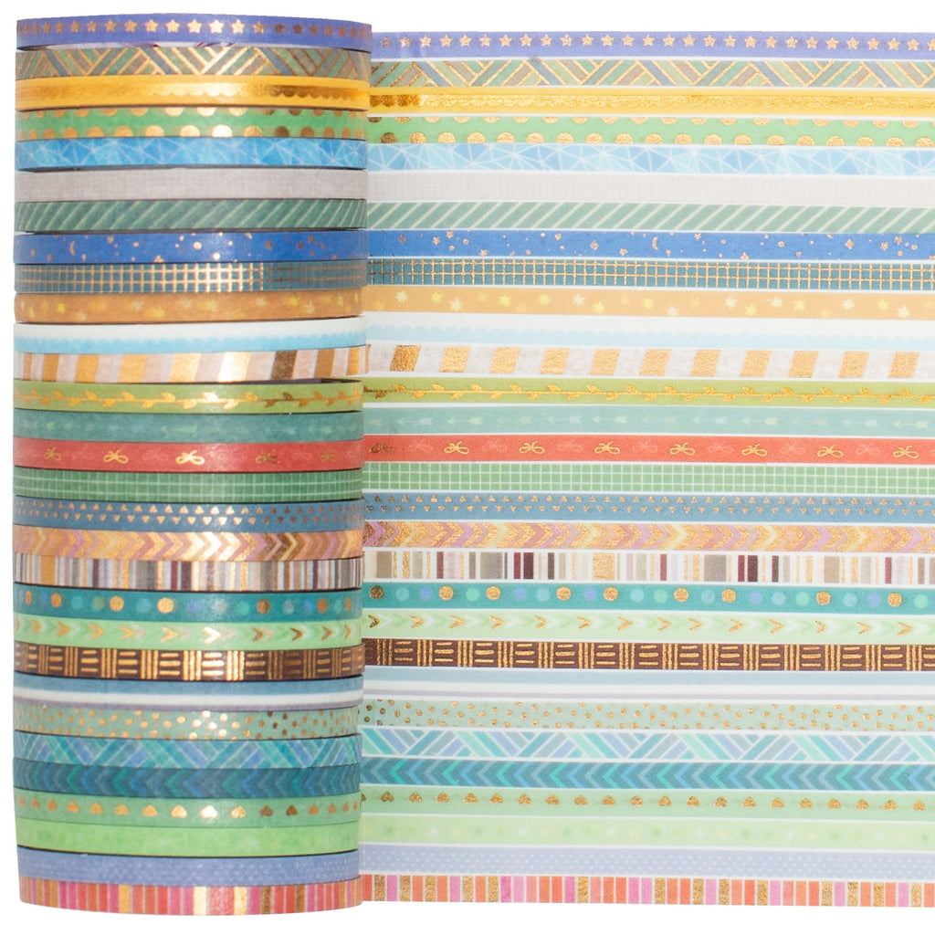 Stack of skinny gold foil washi tape rolls next to a display of unrolled tape patterns on white background