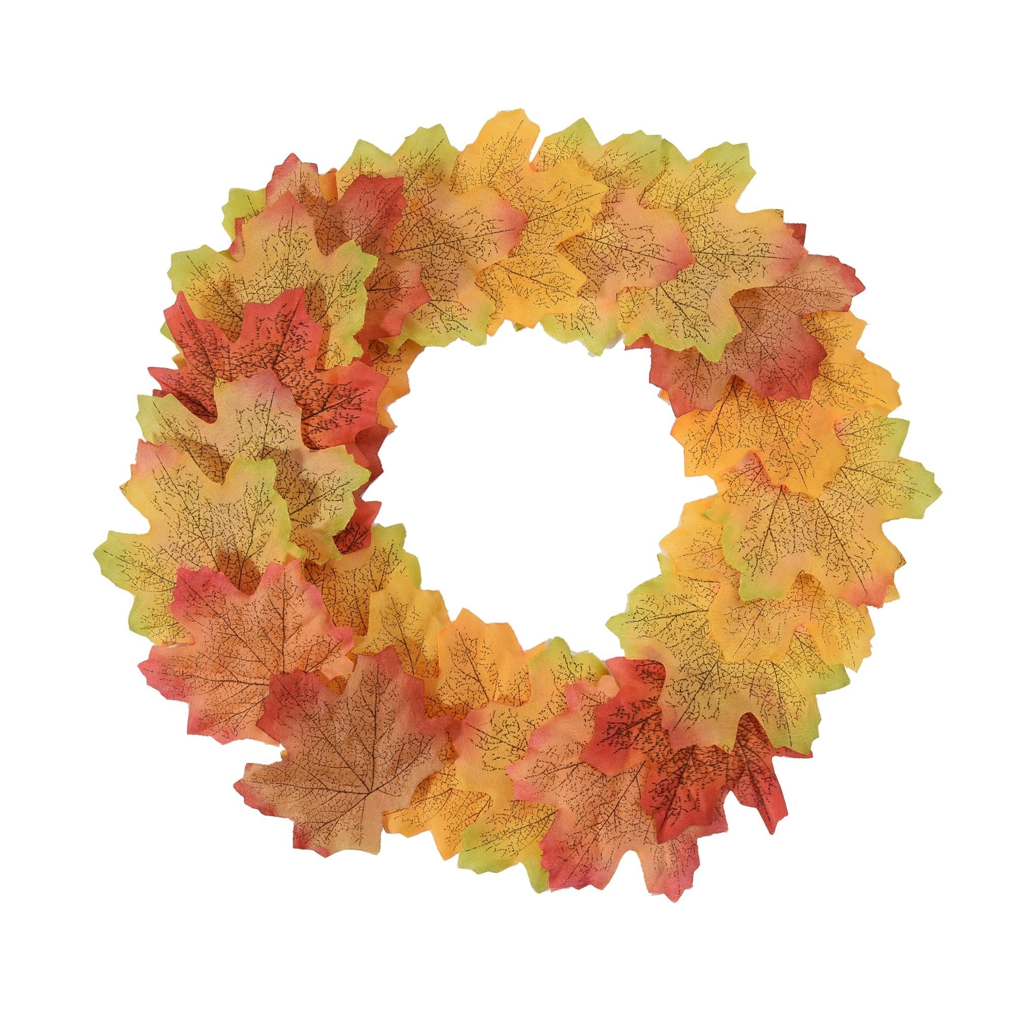 Wreath made of colorful artificial maple leaves in red, orange, yellow, and green hues on a white background.