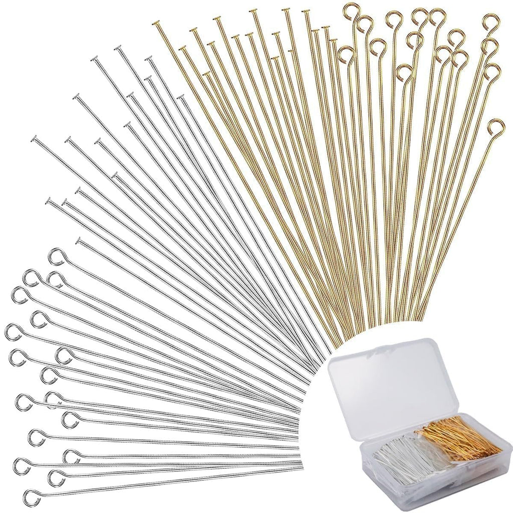 Assortment of gold and silver jewelry pins, including flat head and eye pins, displayed fanned out with a clear storage box in the corner.