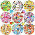 Collage of nine circular arrangements of colorful, cute vinyl stickers featuring animals, food, and objects.