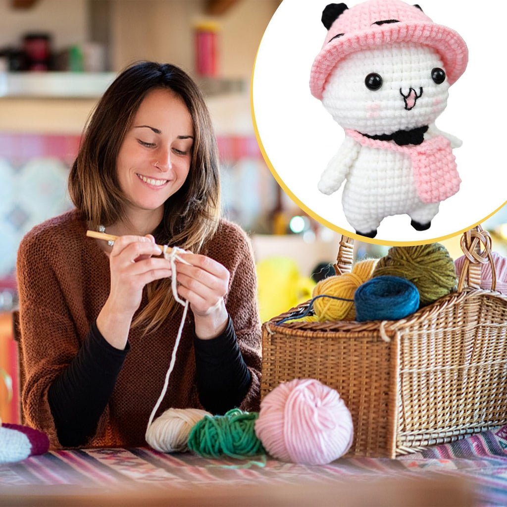 Woman crocheting with yarn and basket of colorful yarn balls, with a close-up of a finished crochet panda toy in a pink hat.
