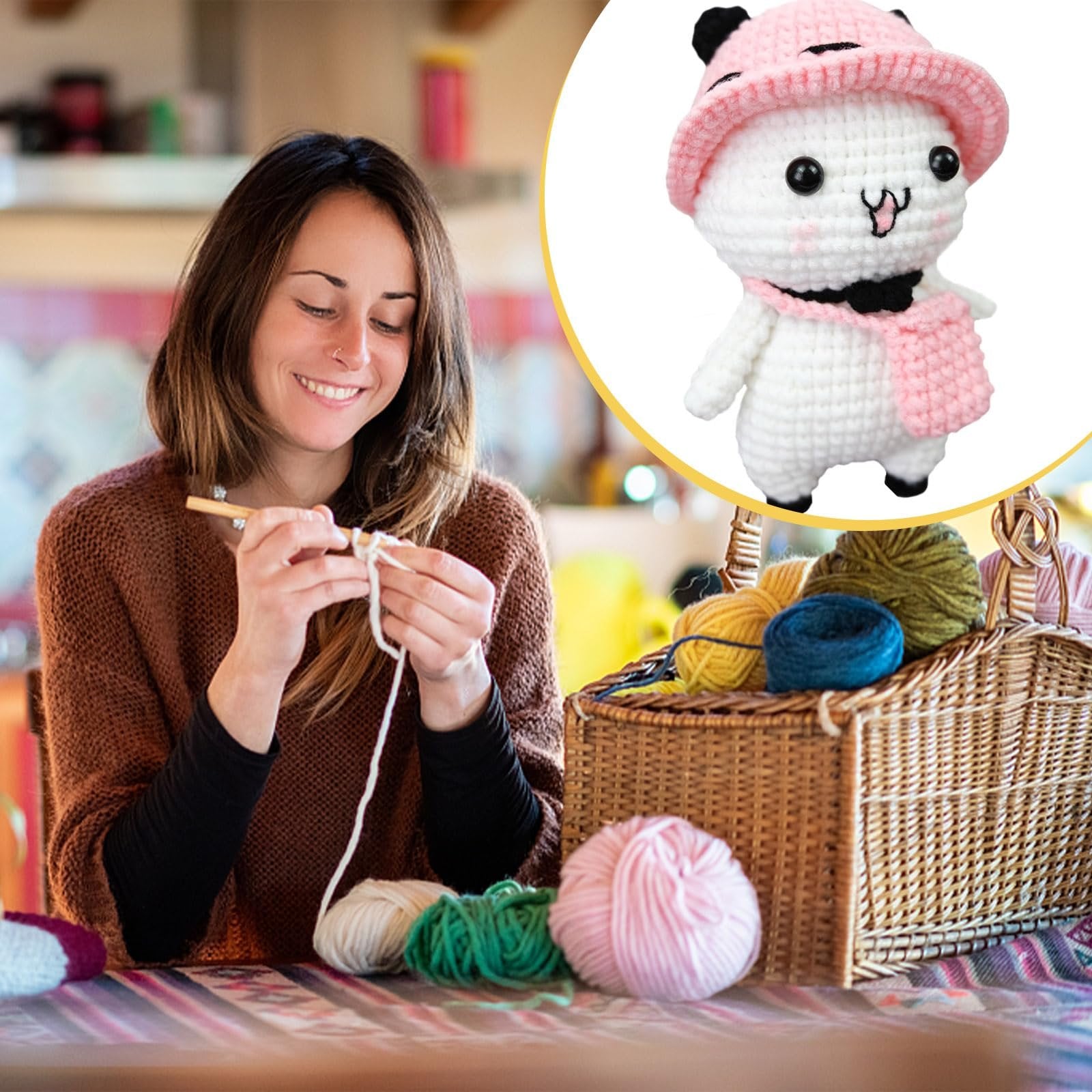 Woman crocheting with yarn and basket of colorful yarn balls, with a close-up of a finished crochet panda toy in a pink hat.