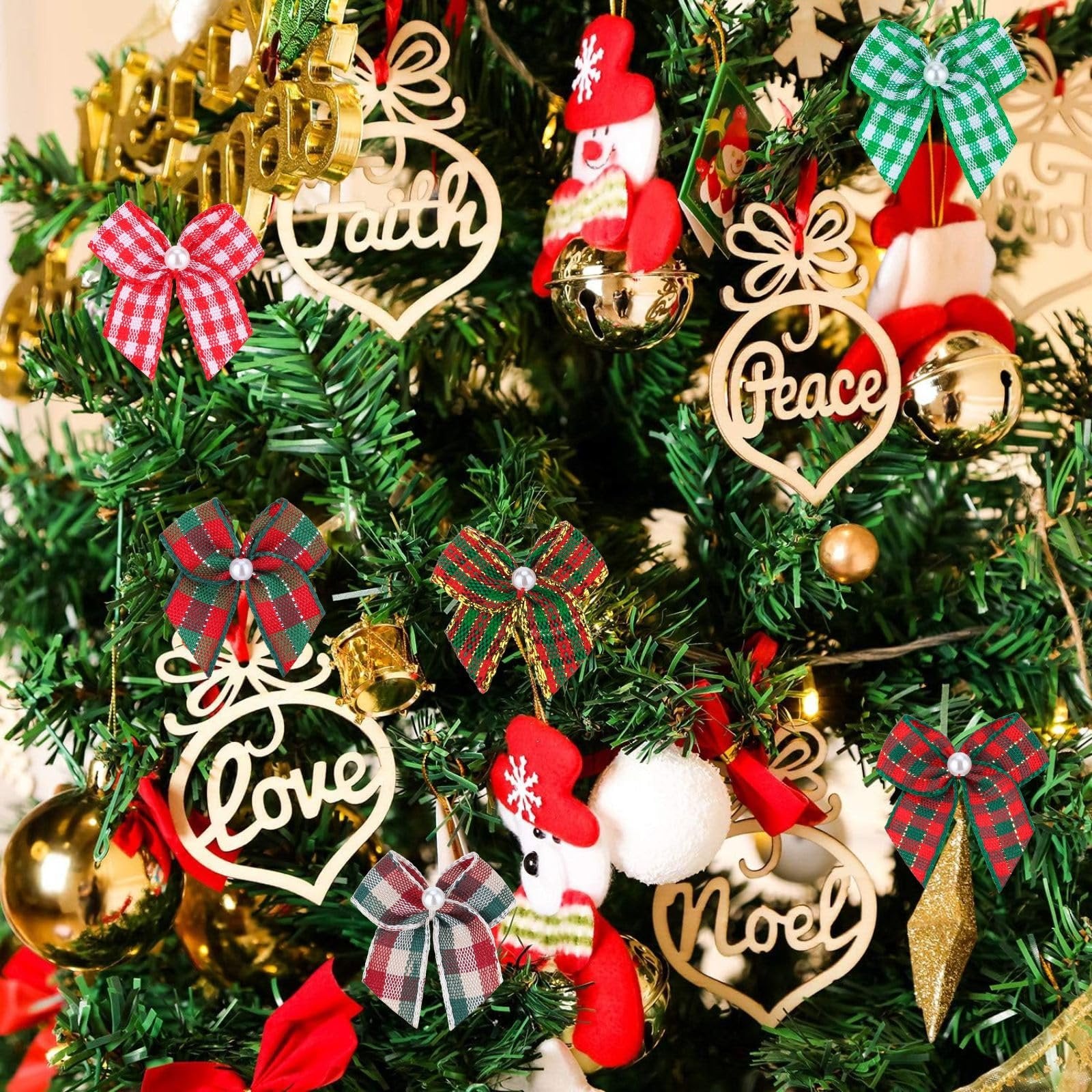 Christmas tree decorated with plaid ribbon bows, ornaments with words Faith, Peace, Love, Noel, and gold baubles.