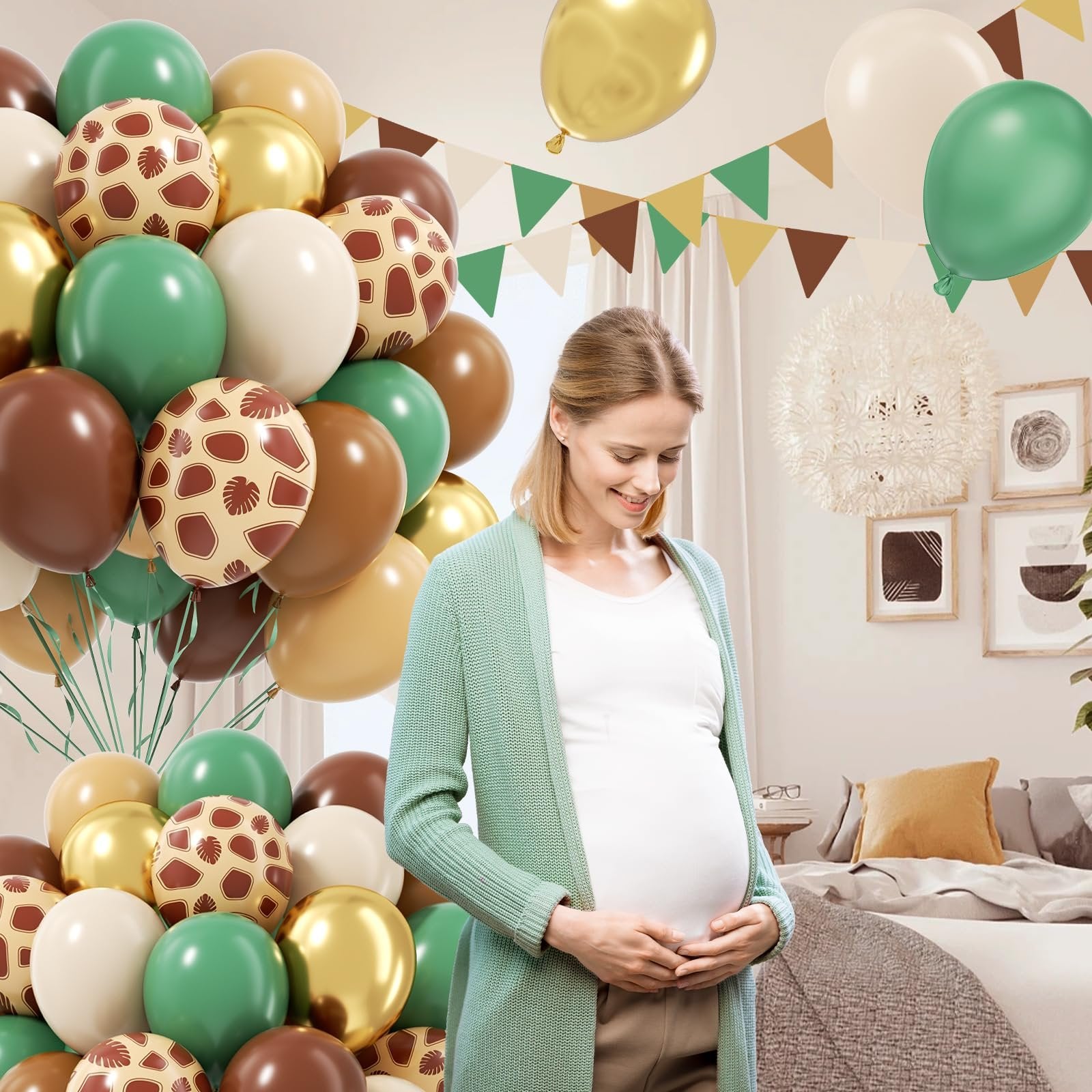 Pregnant woman holding belly with safari-themed balloons and bunting in a bedroom