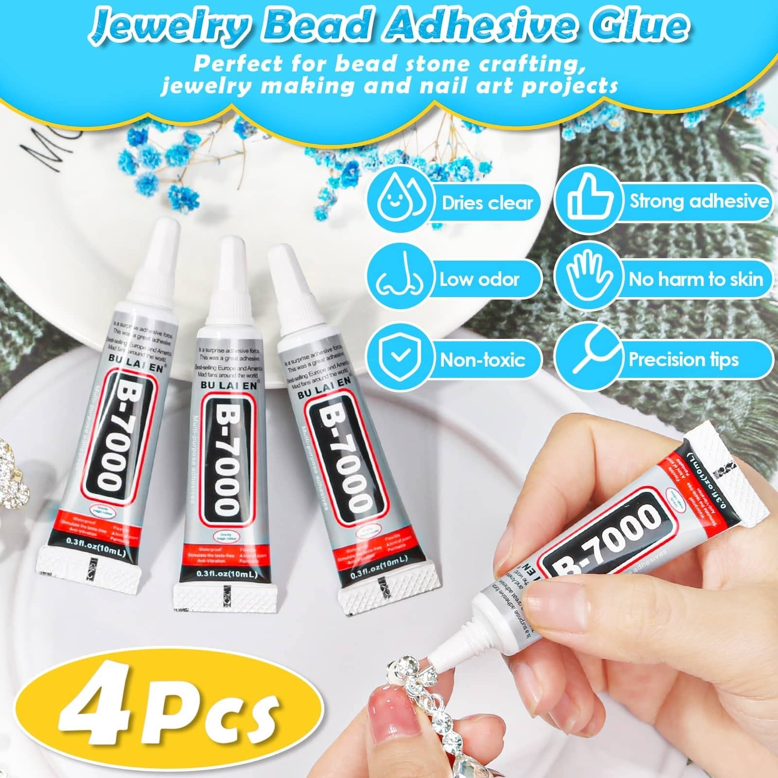 Four tubes of B-7000 adhesive glue and one tube being used to apply glue to rhinestones on jewelry.