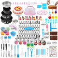 Overhead view of a large cake decorating kit with numerous tools, piping tips, pans, and decorative elements.