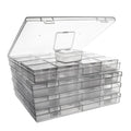 Stack of clear plastic bead organizer boxes with hinged lids, one box open on top.