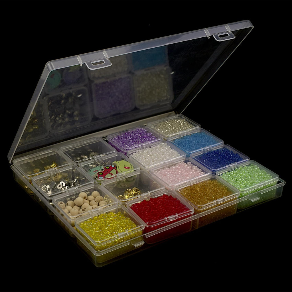 Open clear plastic bead organizer box filled with colorful beads, findings, and wooden beads on a black background.