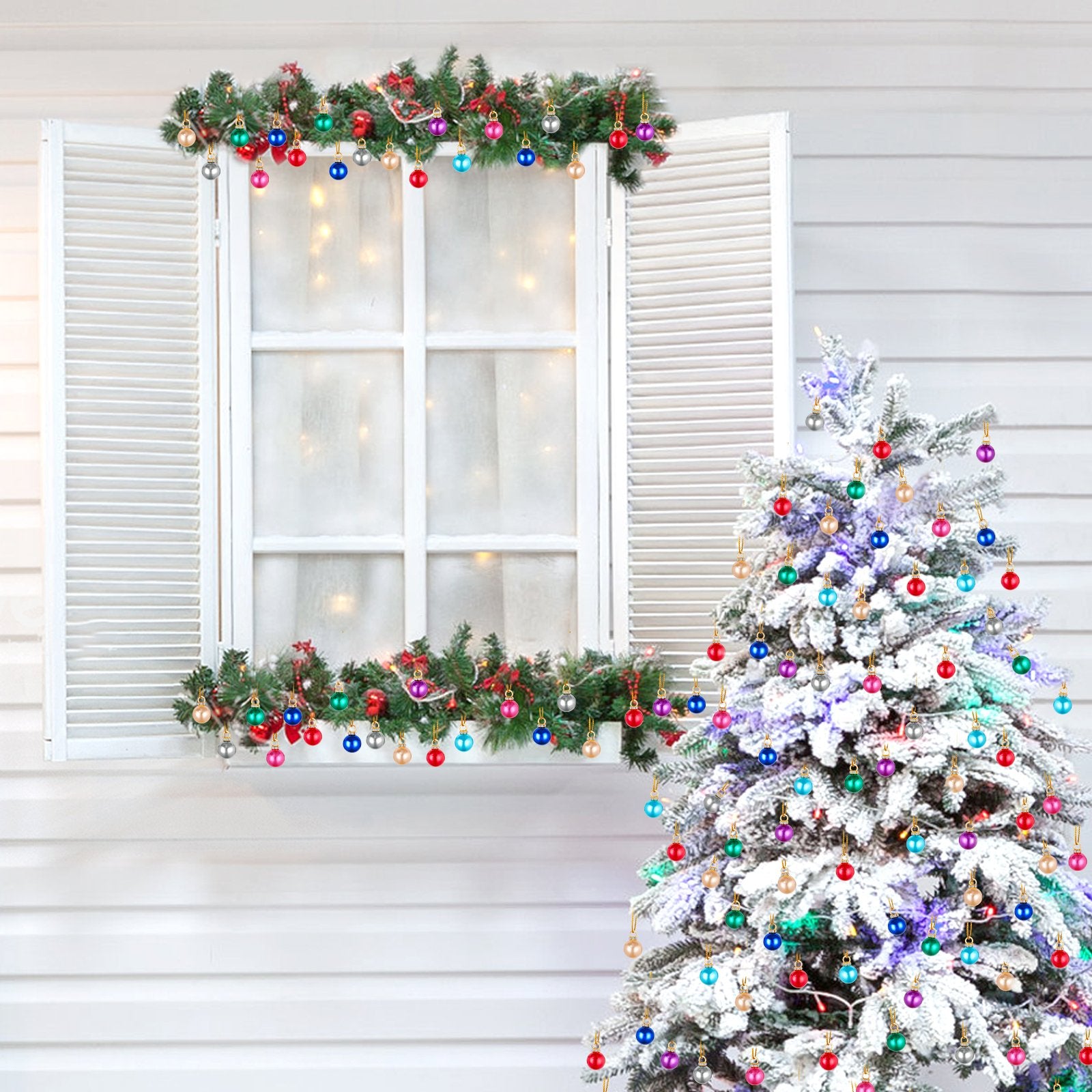Mini Christmas balls ornaments in various colors decorating a flocked Christmas tree and a window garland