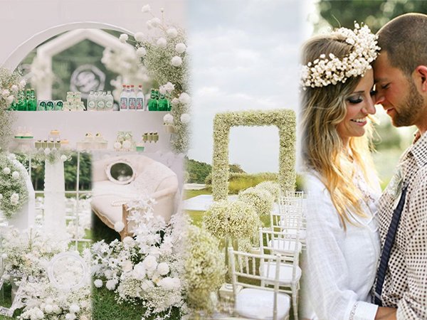 Wedding ceremony setup with white flowers and a couple embracing, featuring a dessert table and chairs.