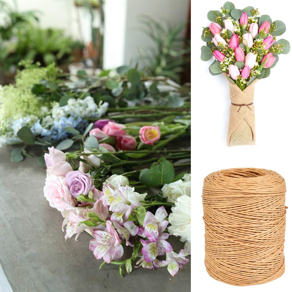 Floral bind wire roll next to a bouquet of pink and white flowers wrapped in burlap