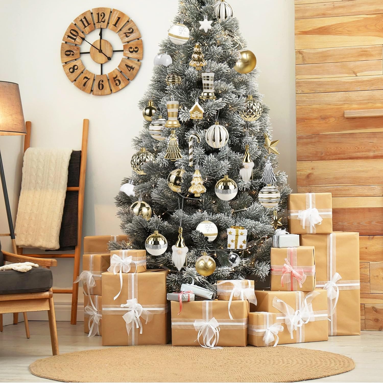 Decorated Christmas tree with white and gold ornaments and wrapped gifts at its base, with a wooden clock on the wall.
