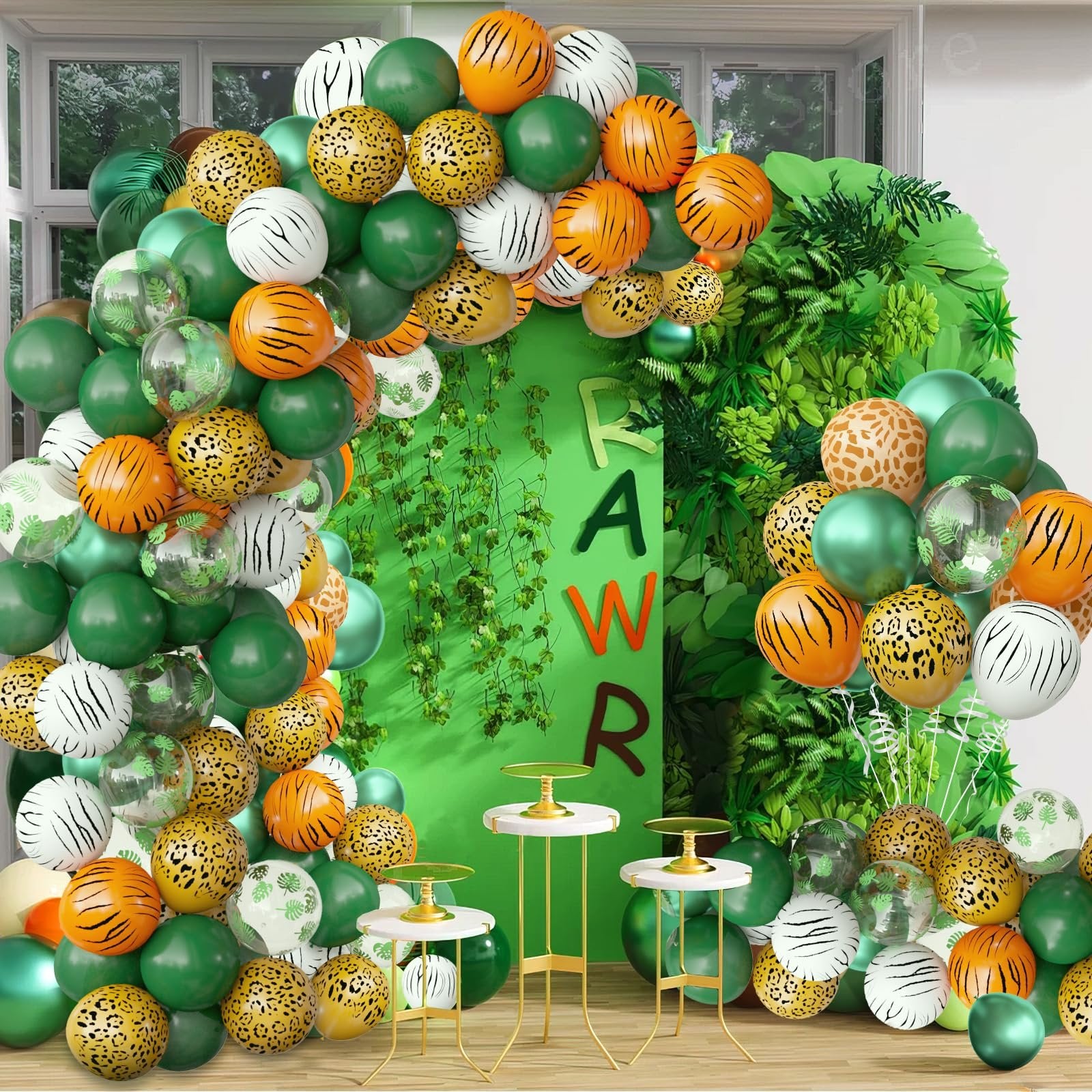 Jungle safari balloon arch with animal prints and green balloons, featuring a green backdrop with 'RAW R' letters.