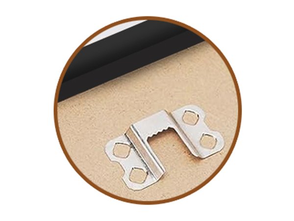 Close-up of a sawtooth picture frame hanger attached to the back of a black frame.