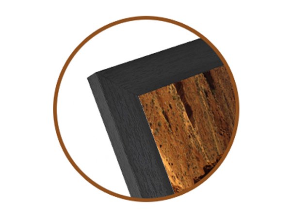 Close-up of a black wood picture frame corner with a wood-grain finish, showing a landscape image inside.