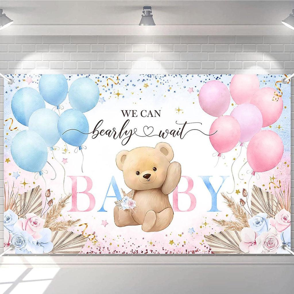 Boho bear gender reveal backdrop banner with pink and blue balloons, pampas grass, and floral accents. Text reads 'We Can Bearly Wait BABY'.
