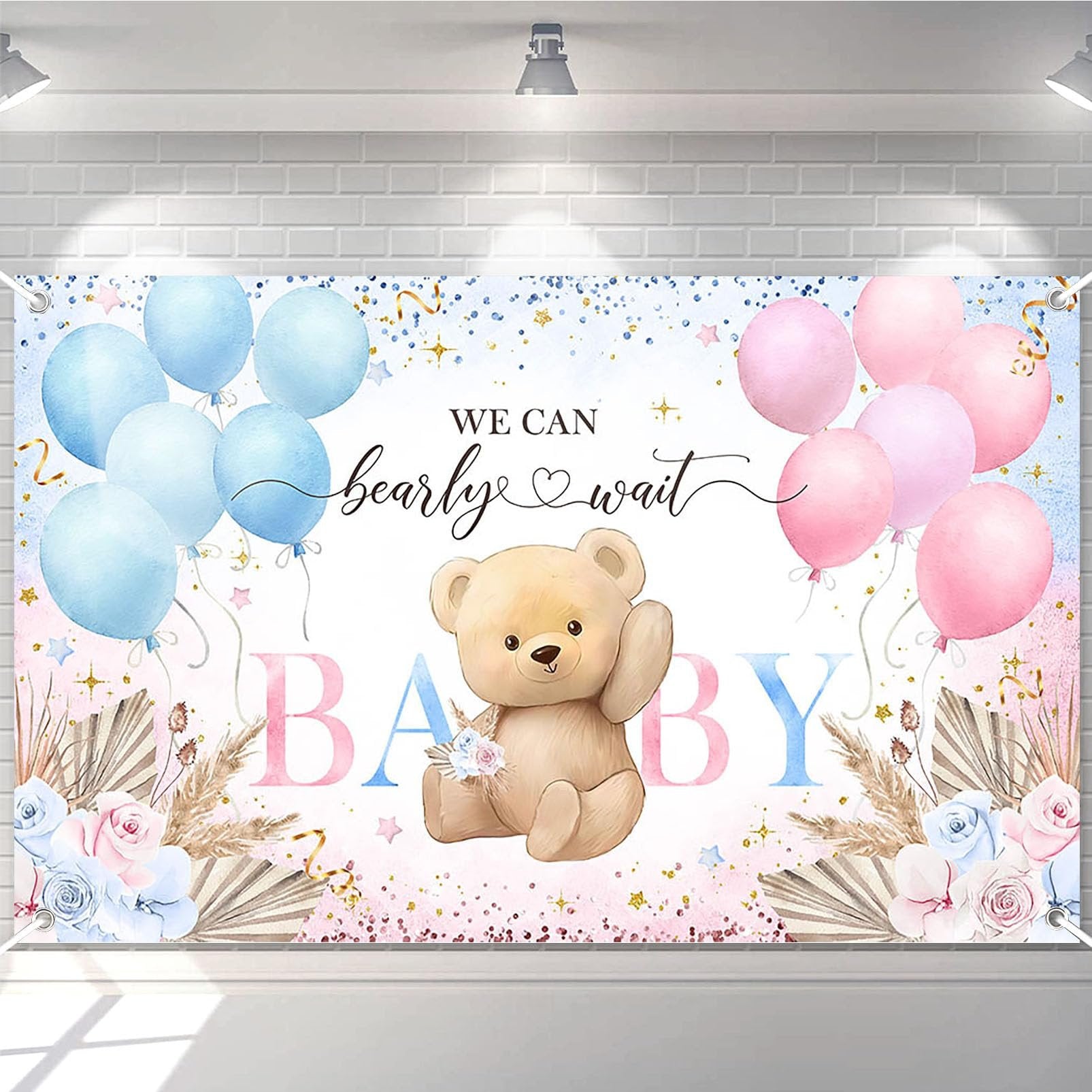 Boho bear gender reveal backdrop banner with pink and blue balloons, pampas grass, and floral accents. Text reads 'We Can Bearly Wait BABY'.