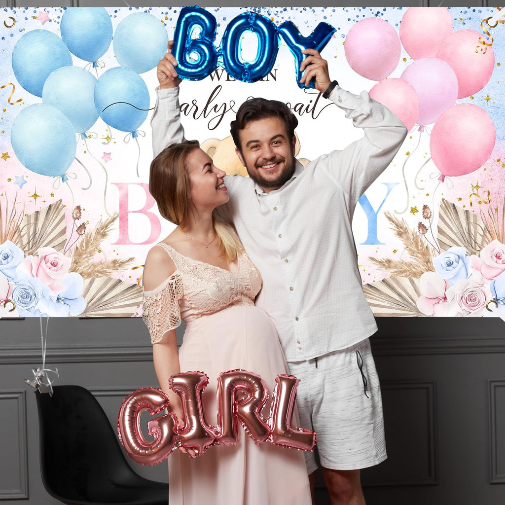 Pregnant couple holding gender reveal balloons, 'Boy' and 'Girl', with floral and pampas grass backdrop.