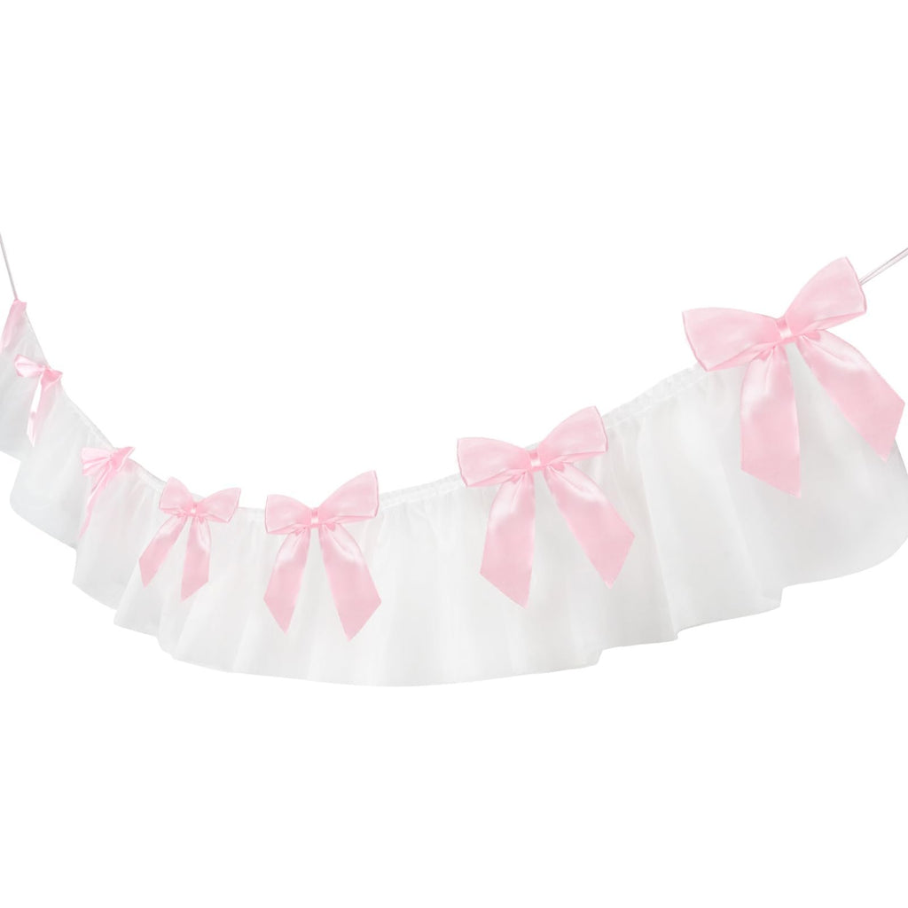 White ruffled banner with pink satin bows against a white background