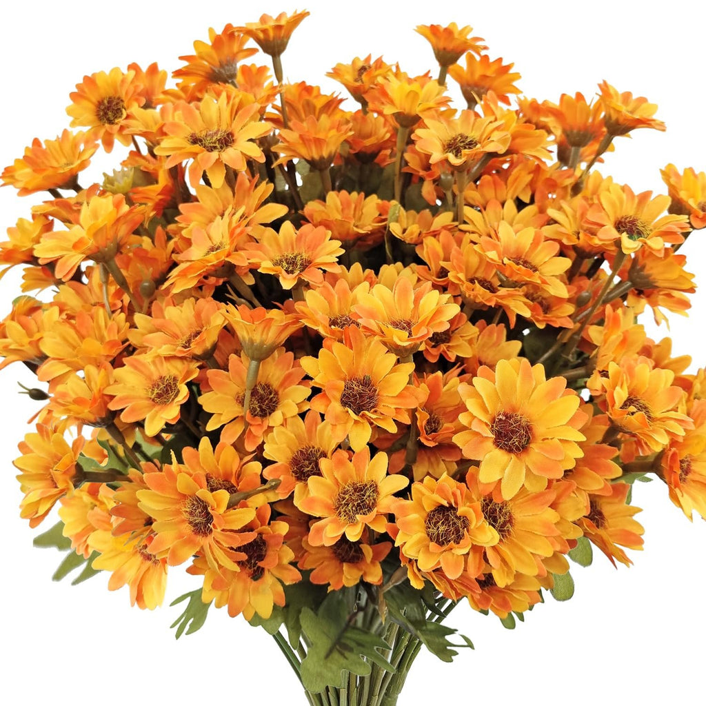 Bouquet of orange artificial mums with green stems, presented against a white background.