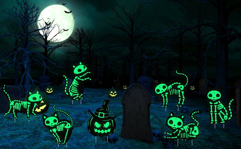 Halloween yard signs with glow-in-the-dark skeleton cats and pumpkins in a spooky graveyard setting under a full moon.