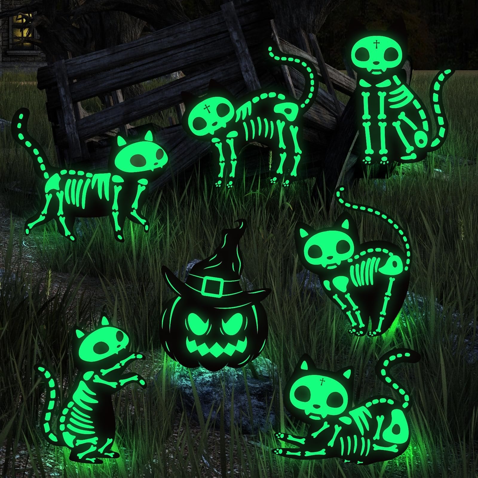 Seven glow-in-the-dark Halloween yard signs featuring skeleton cats and a pumpkin in a grassy, outdoor setting at night.