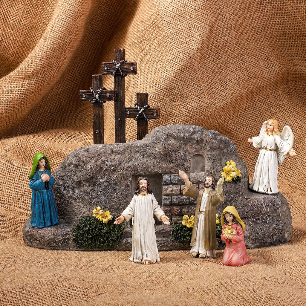 Easter Resurrection Scene tabletop decor with Jesus, angel, Mary, and other figures around a tomb and crosses.
