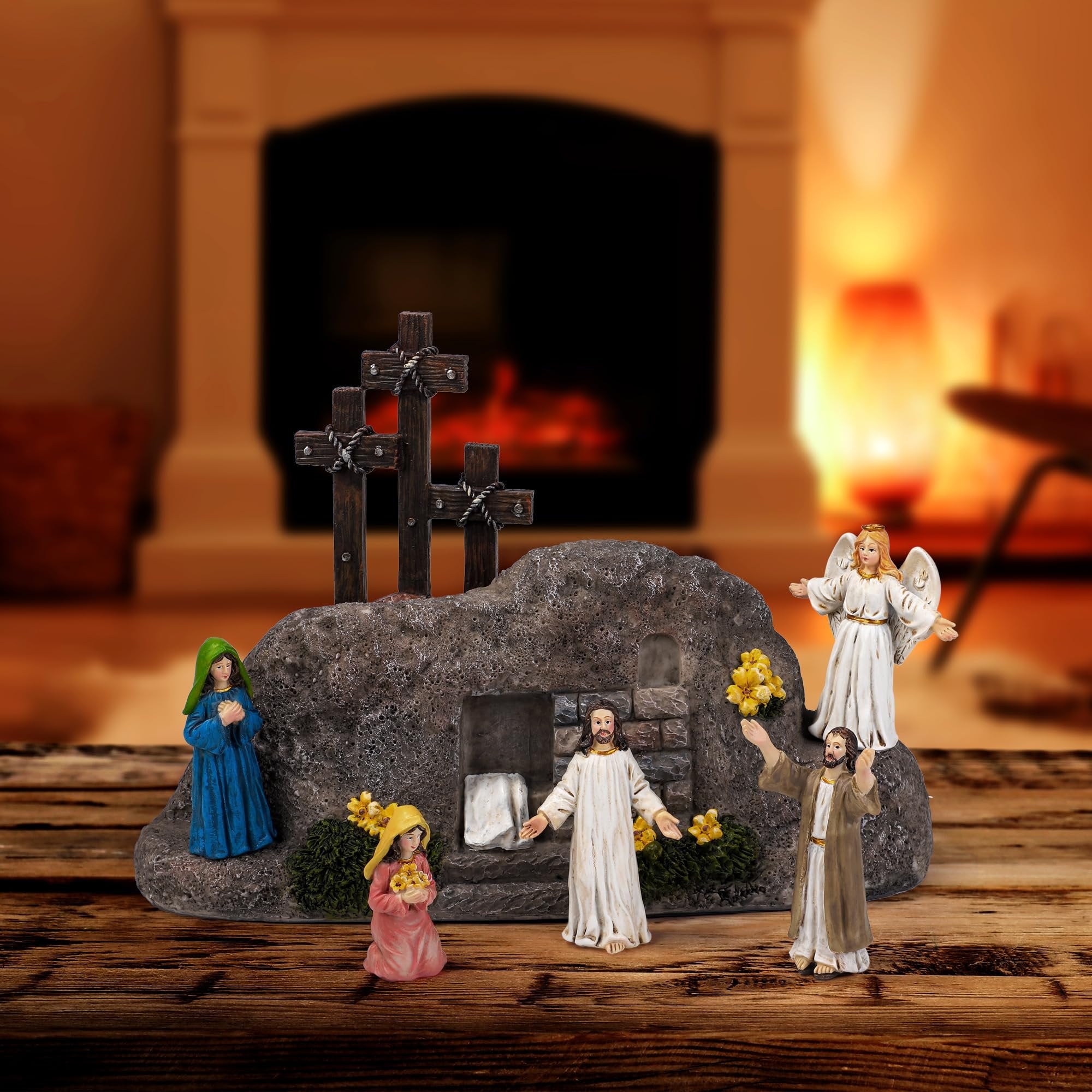 Easter Resurrection Scene tabletop decor with Jesus, angel, Mary, and other figures by a tomb and three crosses.