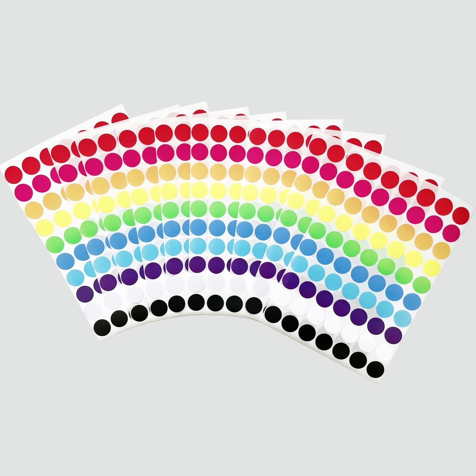 Sheets of 3/4 inch round color coding dot stickers fanned out on a light gray background, showing multiple colors including red, pink, yellow, green, blue, purple, white, and black.