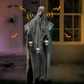 Halloween animatronic grim reaper decoration with LED eyes and skull chain, set against a haunted house backdrop with spiders and bats.