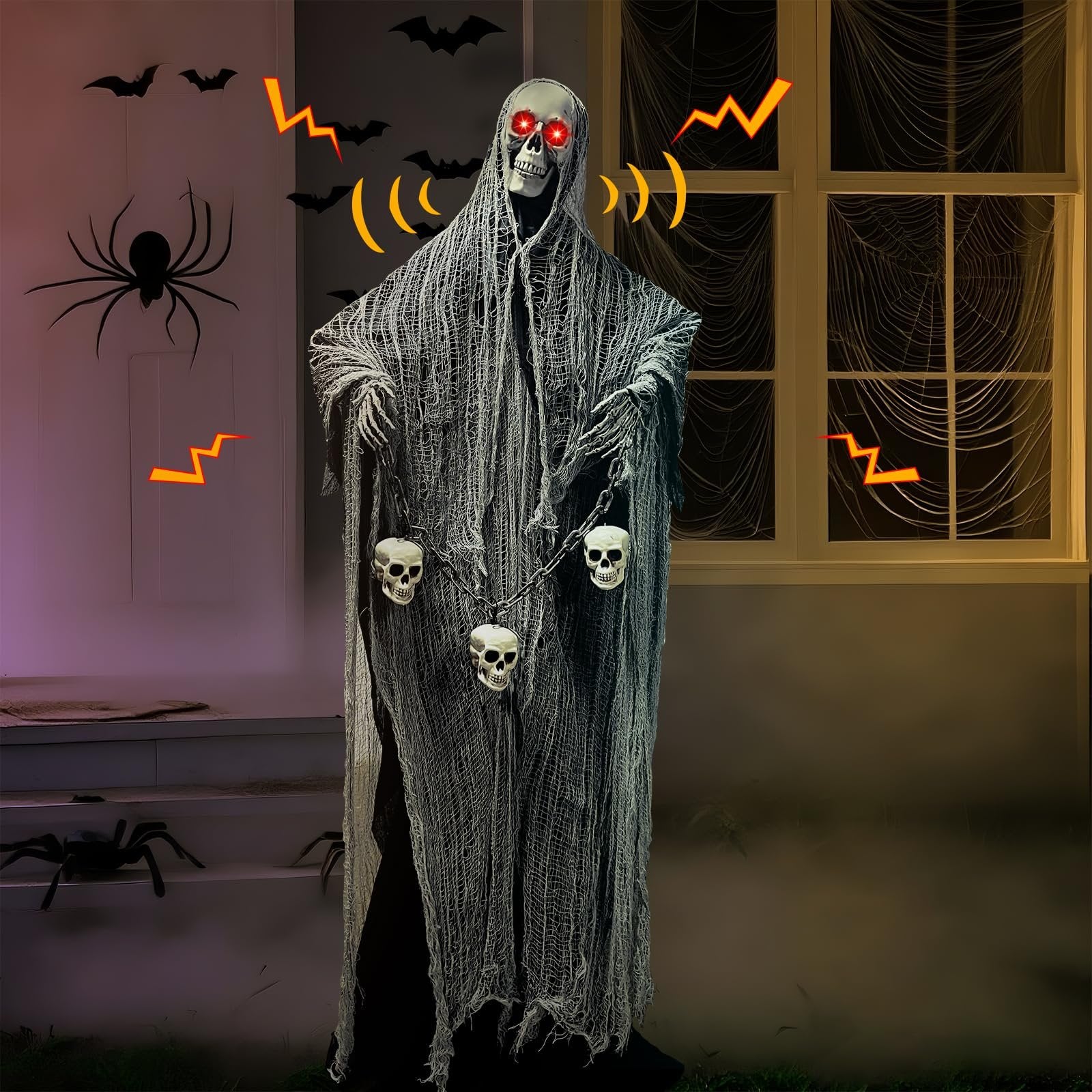 Halloween animatronic grim reaper decoration with LED eyes and skull chain, set against a haunted house backdrop with spiders and bats.