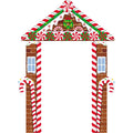 Gingerbread house themed Christmas archway decoration with candy cane pillars and peppermint candy accents.
