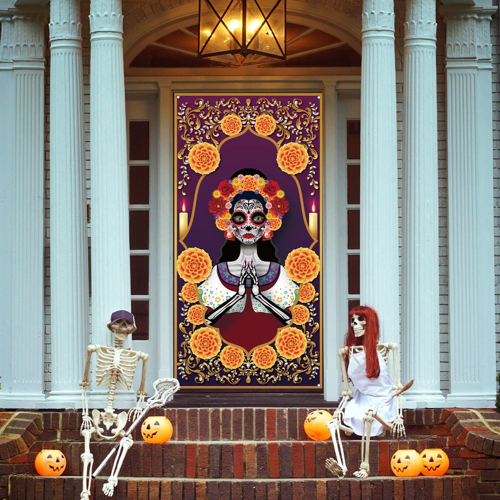Day of the Dead door cover with sugar skull and marigolds, displayed on a front door with skeletons and pumpkins on the steps.