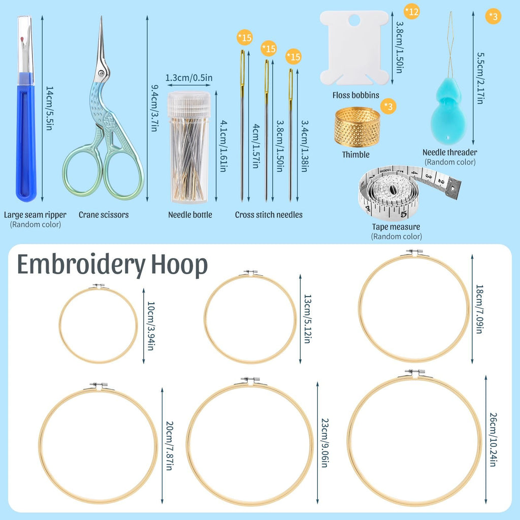 Cross stitch supplies kit with seam ripper, crane scissors, needle bottle, cross stitch needles, floss bobbins, thimble, needle threader, tape measure, and embroidery hoops of various sizes.