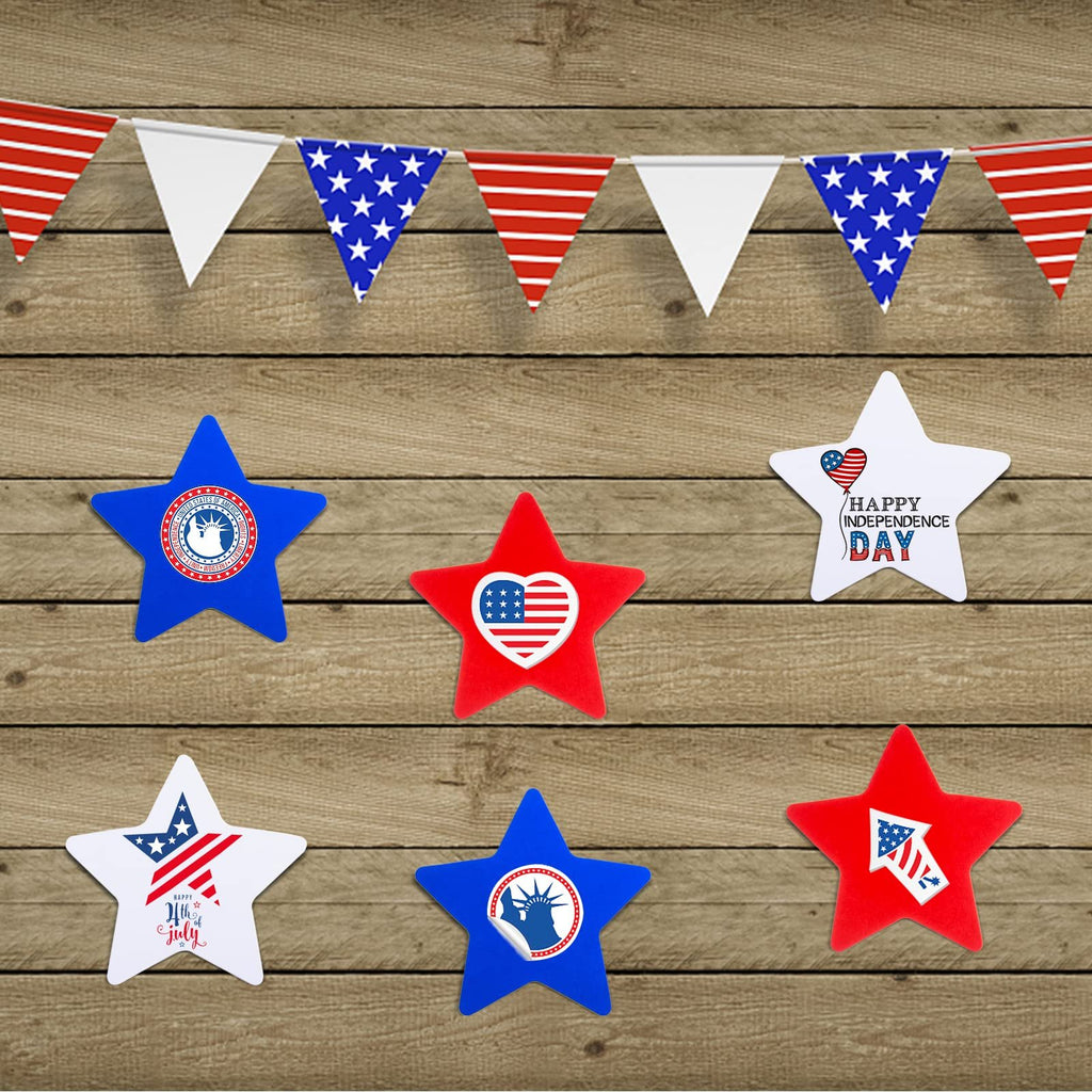 Red, white, and blue star cutouts with patriotic designs arranged on a wooden background with bunting.