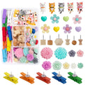 Assorted decorative push pins including cats, flowers, hearts, wooden tacks, and colorful mini clothespins.