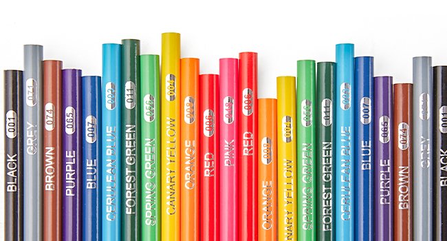A variety of colored pencils arranged in a row, showing their color names and numbers printed on them.