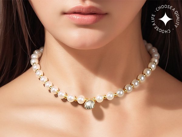 Pearl and gold bead necklace with shell pendant worn by a person