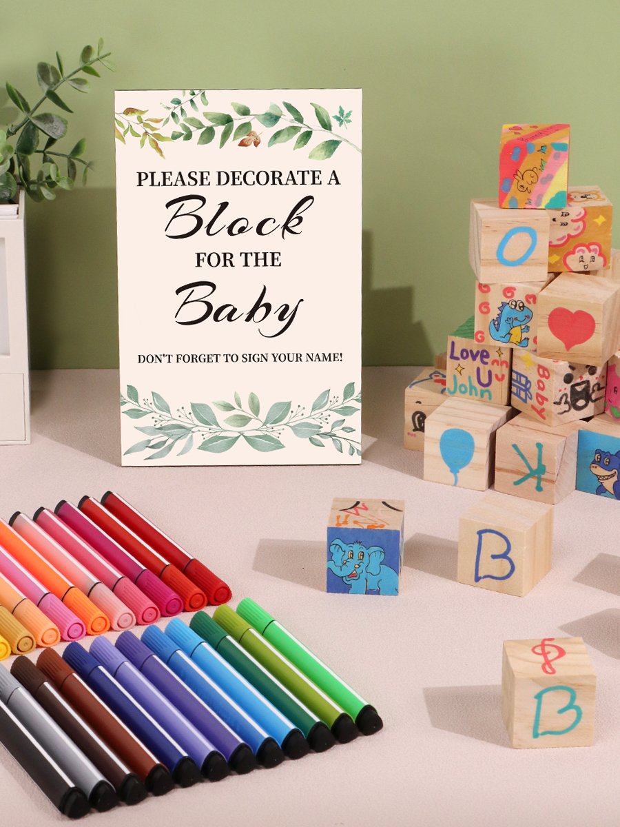 Baby shower block decorating kit with sign, wooden blocks, and paint markers.