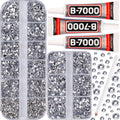 Flatback rhinestones in divided containers with three tubes of clear multi-purpose glue and a white pencil.