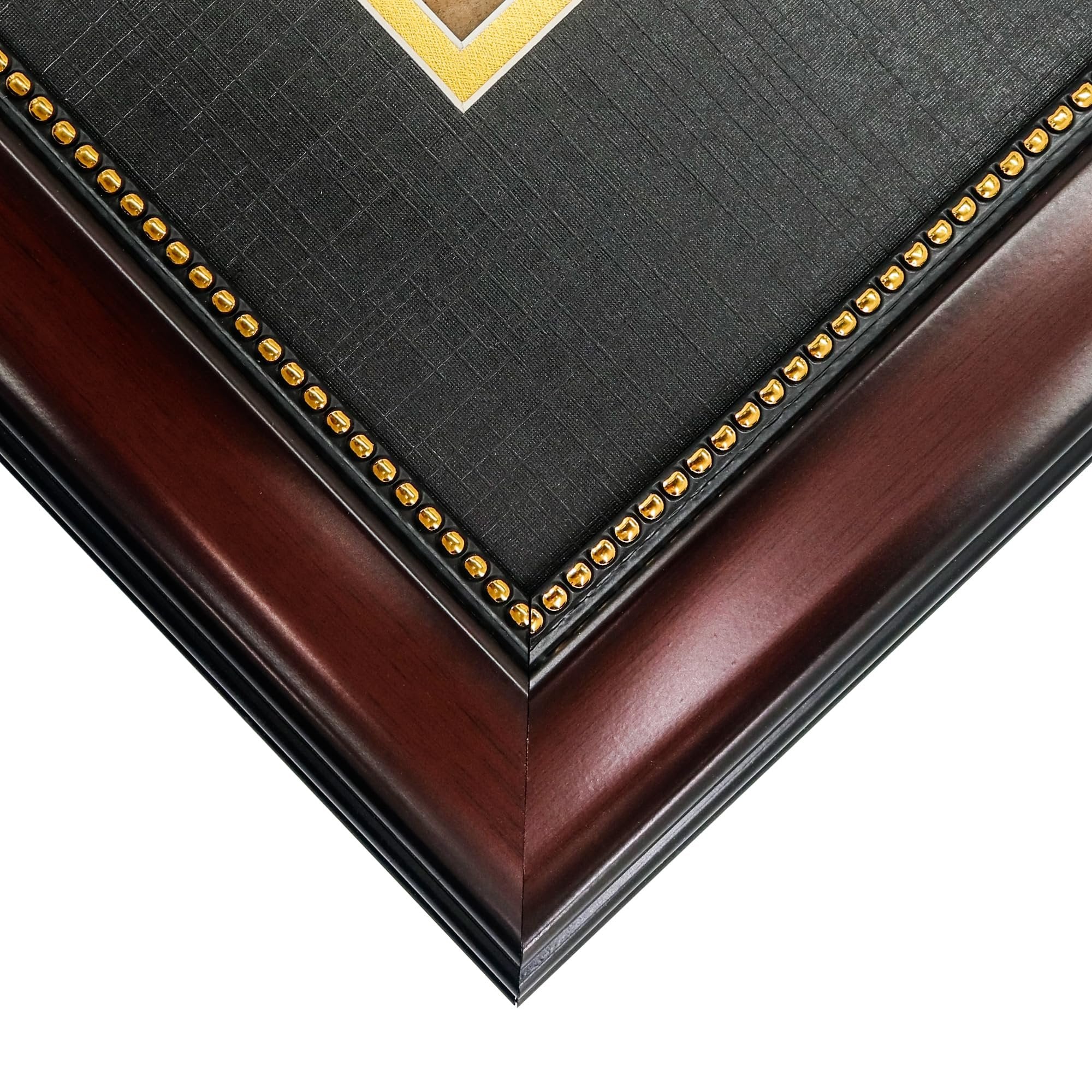 Close-up corner view of a diploma frame with mahogany finish, black mat, and gold bead trim.