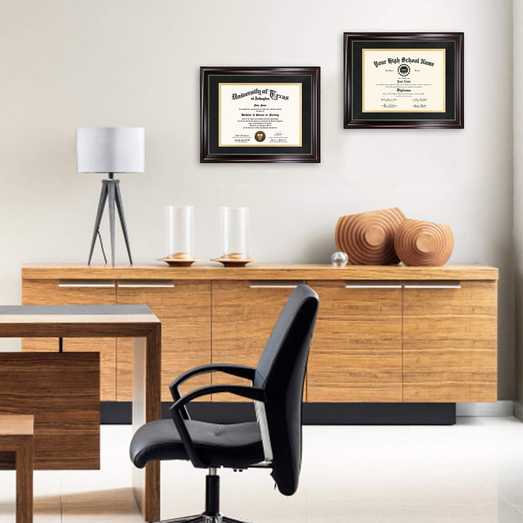 Two diploma frames hanging on a wall above a wooden credenza, one displaying a University of Texas diploma and the other a high school diploma.