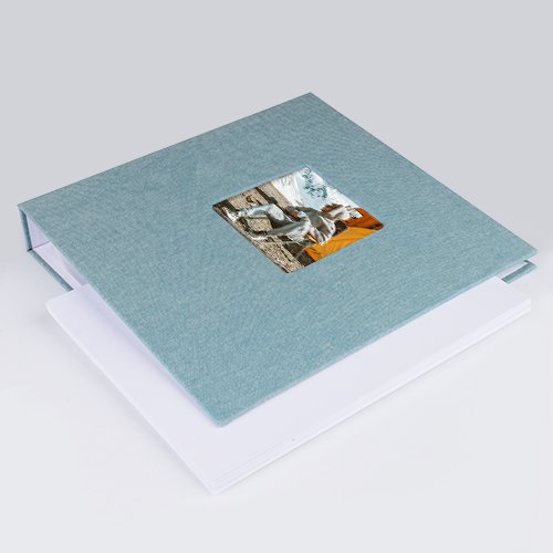 Cyan blue 8.5x11 inch 3 ring scrapbook album with a photo window on the cover, shown open with blank pages inside.