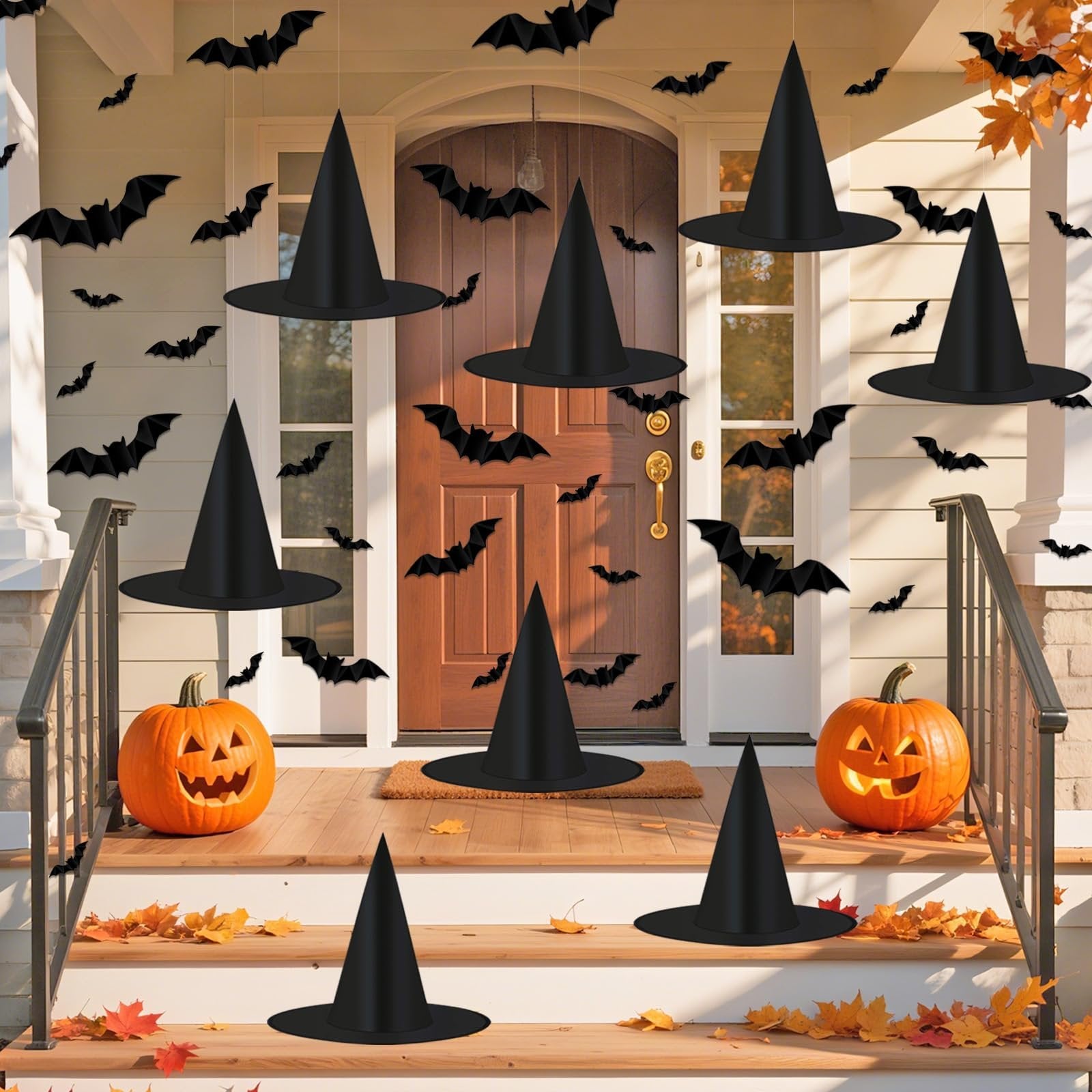 Halloween porch decoration with black witch hats and 3D bats hanging, plus carved pumpkins on steps
