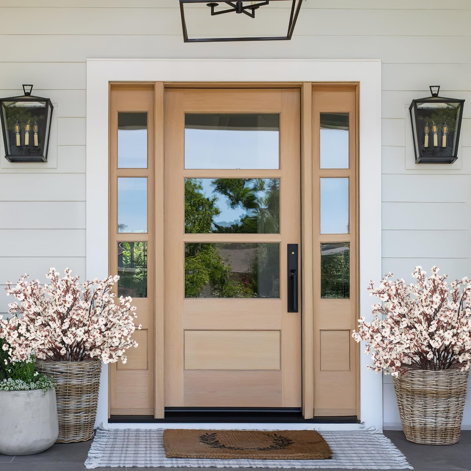 Front door with two large baskets of white baby's breath flowers on either side.