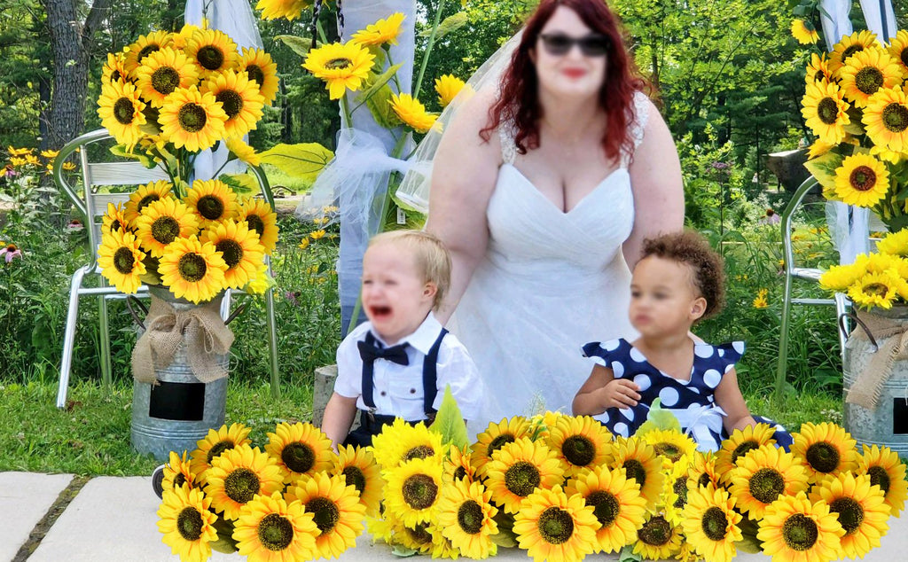 Bride and two children with artificial sunflowers at an outdoor wedding ceremony